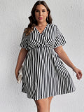 deanwangkt-1 Plus Size Vacay Dress, Women's Plus Floral Print Flutter Sleeve Surplice Neck Nipped Waist Ruched Midi Dress