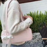 DEANWANGKT 2025 Niche commuter girl bag popular new pillow bag high-end shoulder bag bow portable underarm bag women