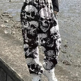 Plus Size Halloween Goth Pants, Women's Plus Allover Skull Print Elastic High Rise Slight Stretch Straight Leg Trousers